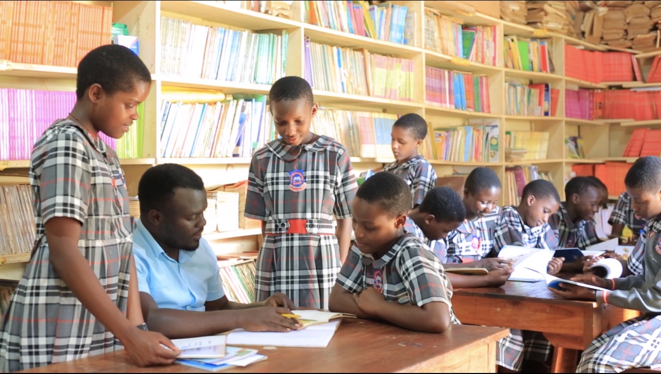 Teachers attending to pupils on topics they need more light on the books found in the school library 3